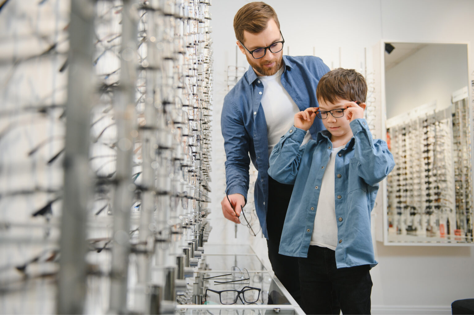 Father with son buying glasses